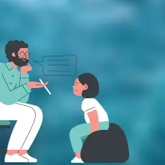 Psycholog rozmawia z dzieckiem, które może mieć ADHD. Specjalista uważnie słucha i notuje.